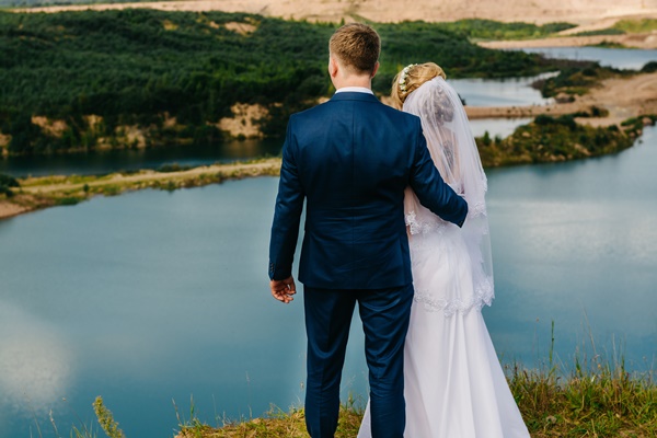 31-couple-standing-near-body-of-water-1393473