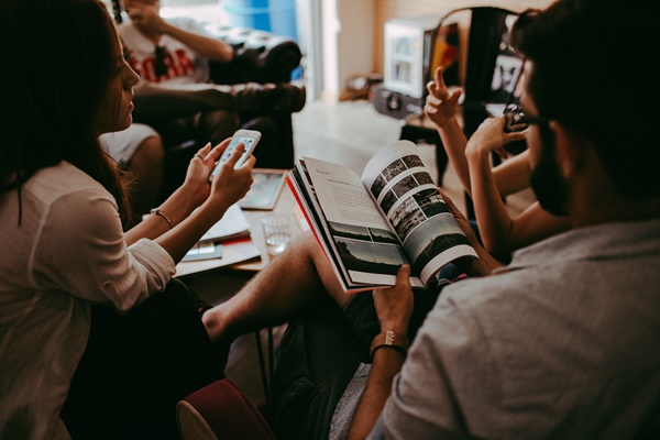52-group-of-people-reading-book-sitting-on-chair-711009