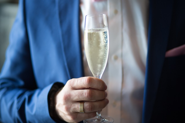 man-holding-filled-champagne-1121331