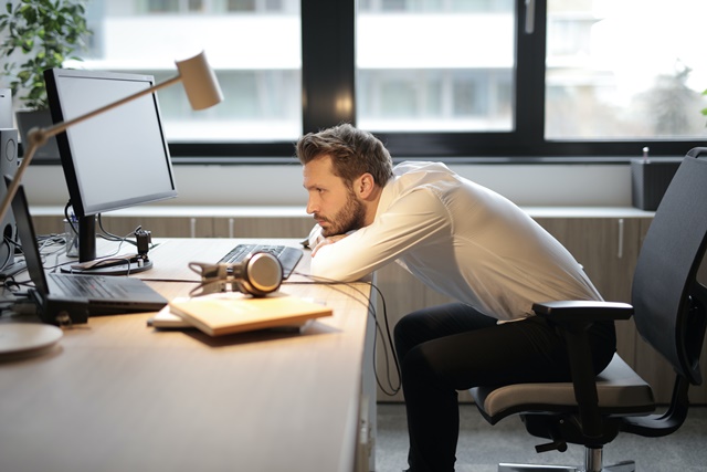 man-in-white-shirt-sitting-on-chair-3966781-1
