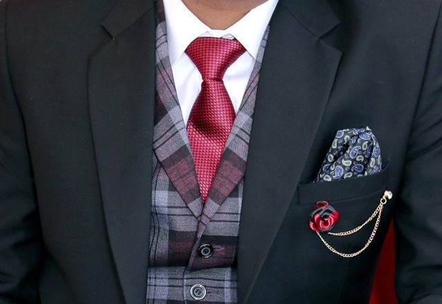 man-wearing-black-notched-lapel-suit-jacket