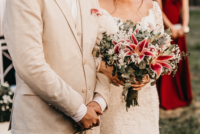 photo-of-woman-holding-bouquet-of-flowers-3292695