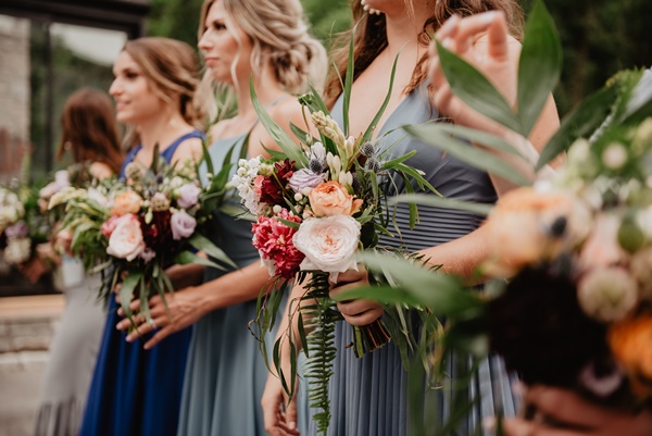 selective-focus-photography-of-women-holding-wedding-flowers-3585806