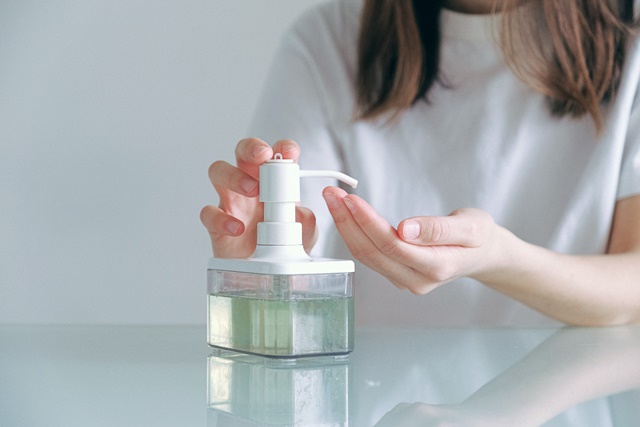 woman-in-white-shirt-holding-clear-container-3986970